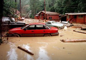 Cars mired in mud and flood waters