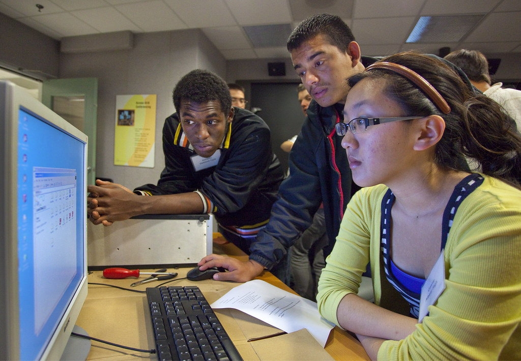 Image of Diverse Students Working on Project on Computer