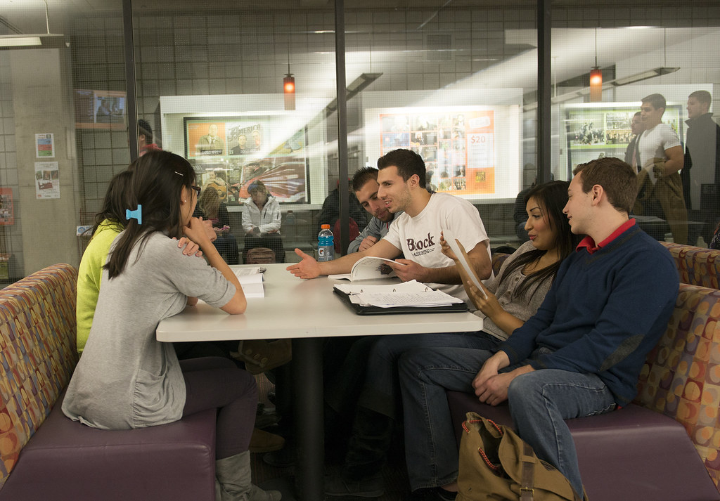 Image of Students Conversing at Lunch Table