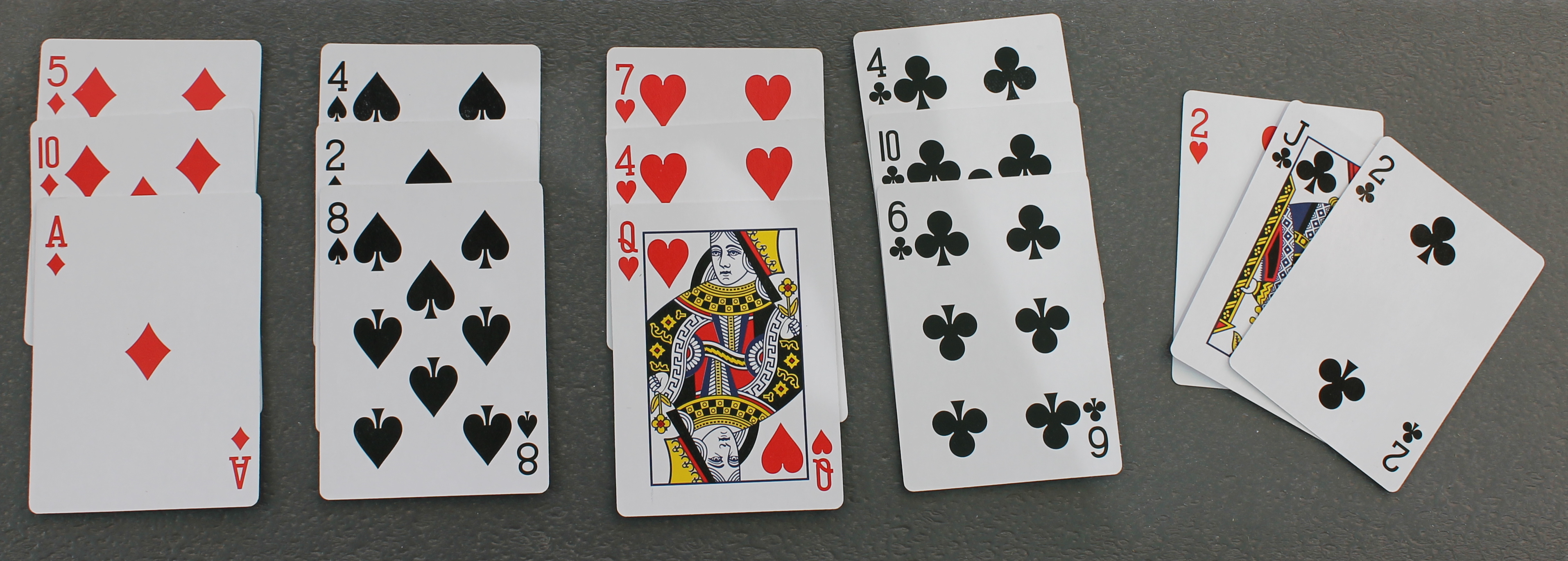 Fifteen cards, three diamonds, three spades, four hearts, five clubs.