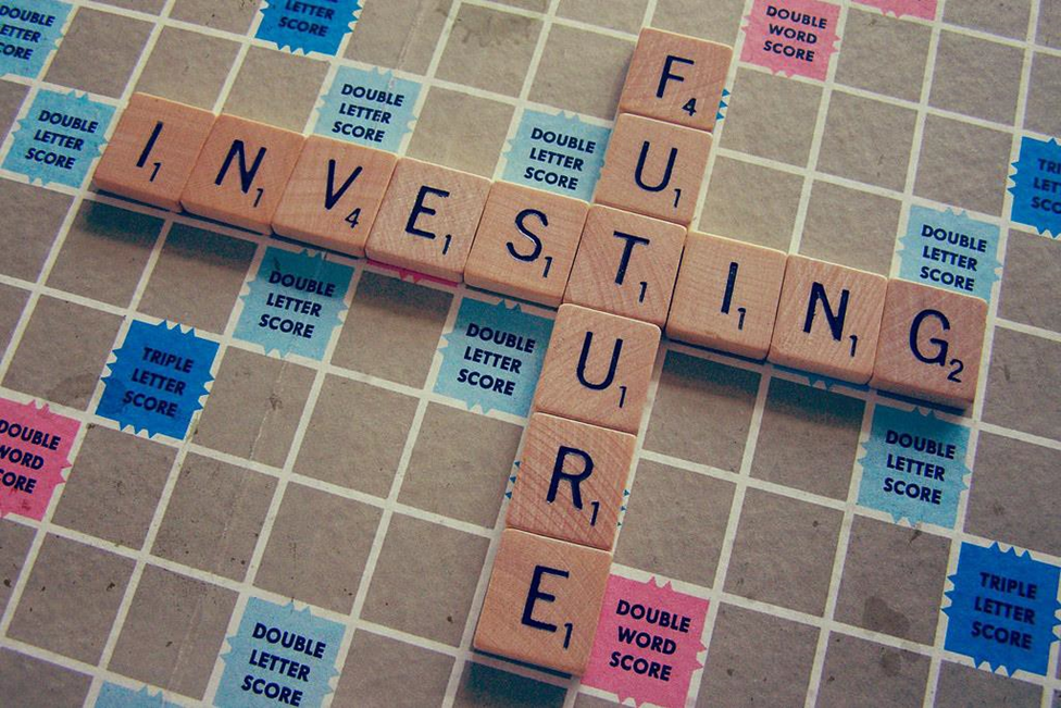 Photo of Scrabble Board with Words "Investing" and "Future"