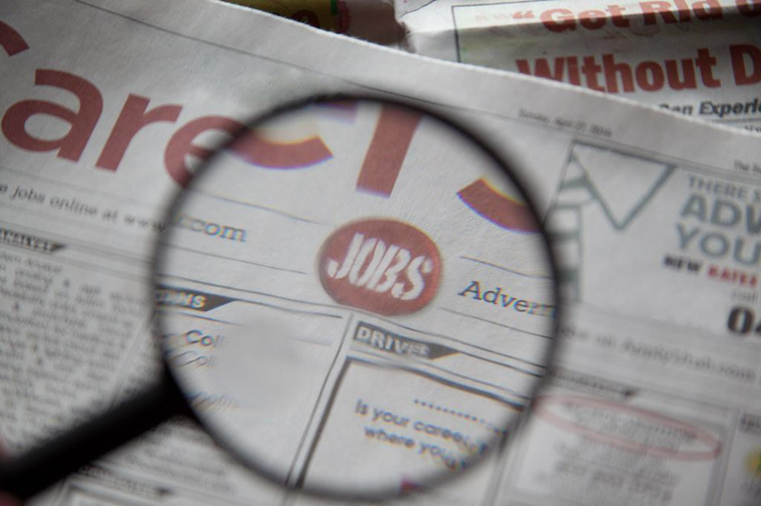 Image of Job Classified Ads with "Jobs" under a Magnifying Glass