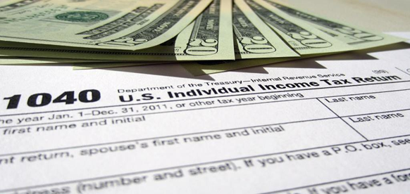 Image of 1040 Income Tax Form and Money