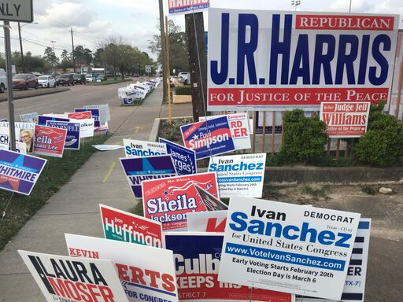 Campaign signs at a Houston early voting location