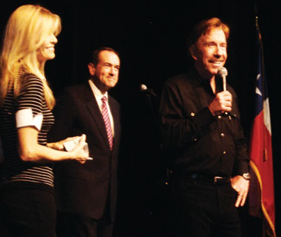 Chuck Norris speaks at a rally for Mike Huckabee in College Station, Texas