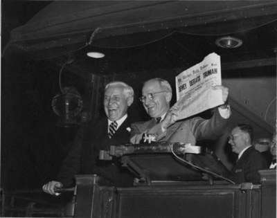 President Harry Truman holding a newspaper that prematurely announced his loss in the 1948 presidential election